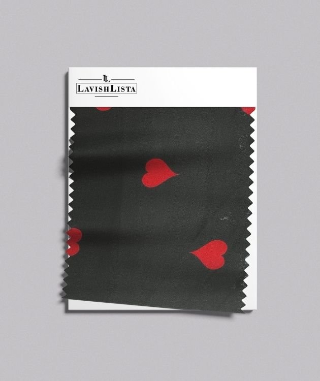 Black cotton blend fabric with red heart print