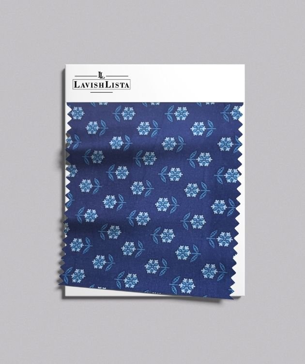 Blue cotton blend fabric swatch with small white and blue floral print
