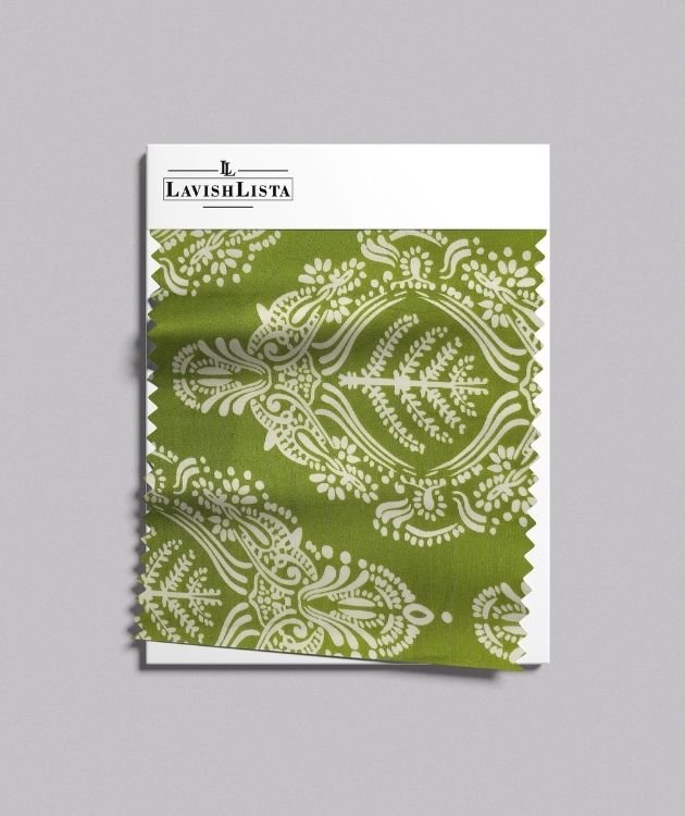 Green cotton blend fabric with intricate white ornate print.