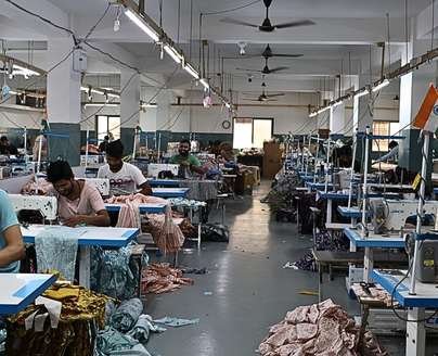 garment factory with workers sewing clothes
