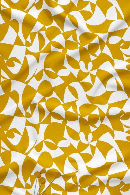 Abstract digital printed fabric with ivory leaf shapes on mustard yellow background