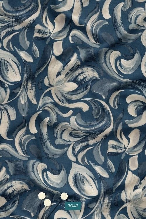Blue abstract brushstroke floral printed fabric with ivory nature-inspired motifs