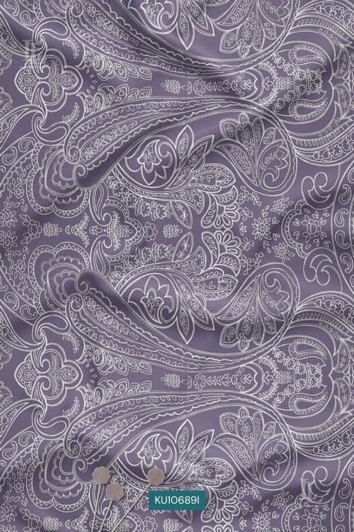Lavender fabric with intricate white paisley digital print design