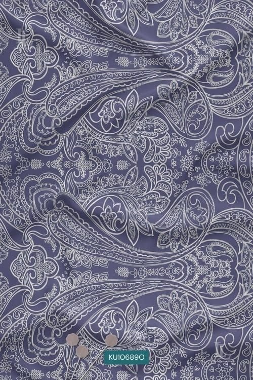 Purple fabric with intricate white paisley digital print design