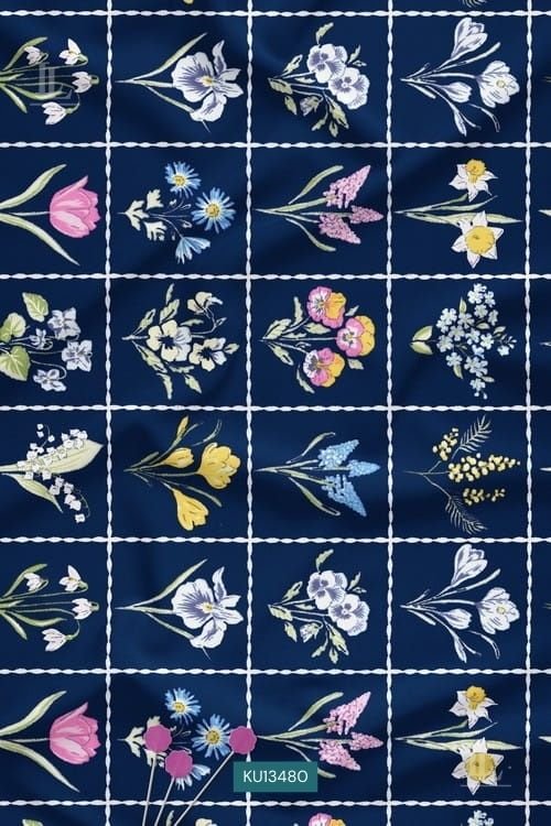 Vibrant botanical bouquets framed in a white grid on midnight navy fabric