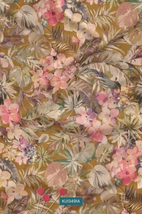 Pink orchids and tropical leaves on a warm ochre botanical print fabric