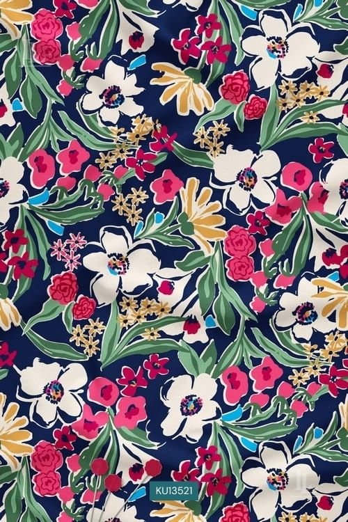 Vibrant pink and white wildflower print on a deep navy blue fabric