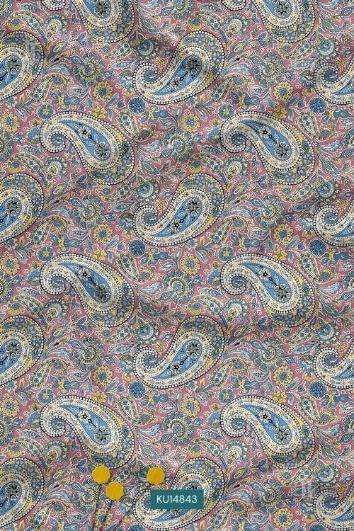 Pastel pink fabric with blue and yellow paisley floral print