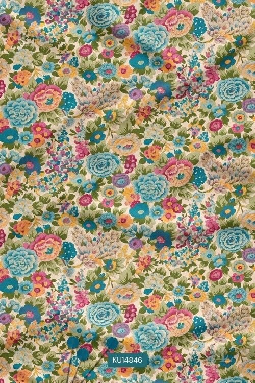 Cream base fabric with vibrant multicolor floral print pattern