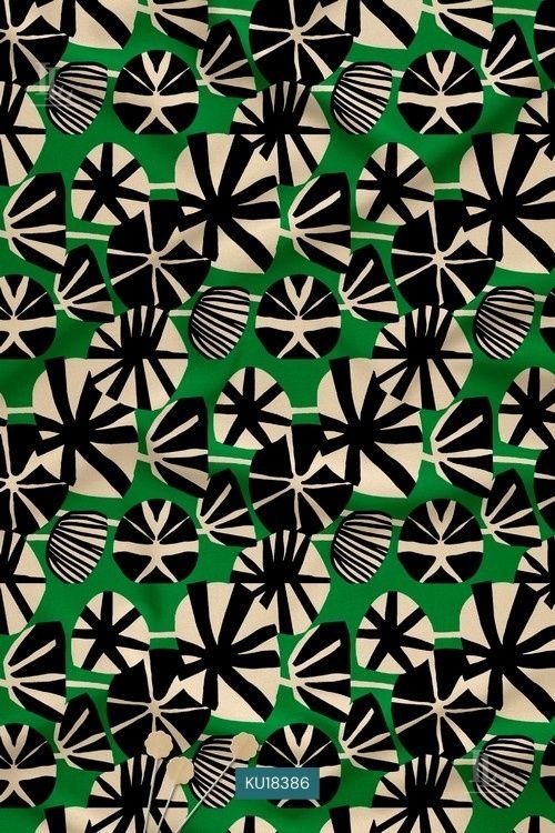 Green fabric with bold black and beige abstract floral geometric print pattern