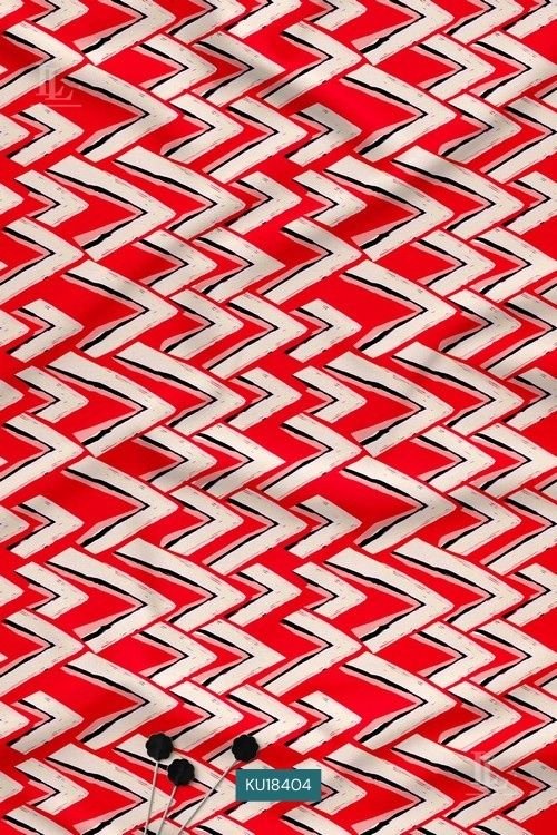 red fabric with sharp white and black interlocking zig-zag chevron patterns