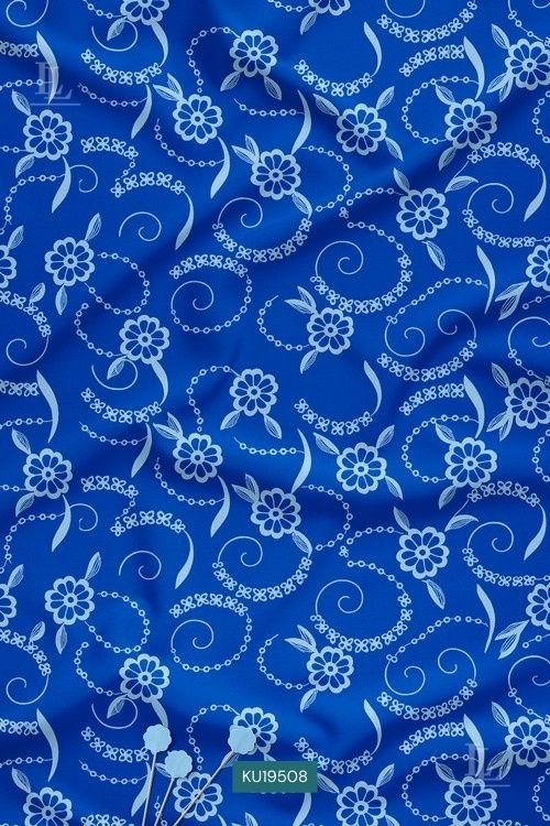 Blue fabric with white filigree floral and swirling vine digital print pattern